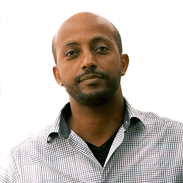 Portrait of an African man looking directly into the camera with a neutral facial expression.